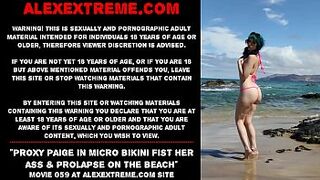 Proxy Paige in micro bikini fist her behind & prolapse on the beach